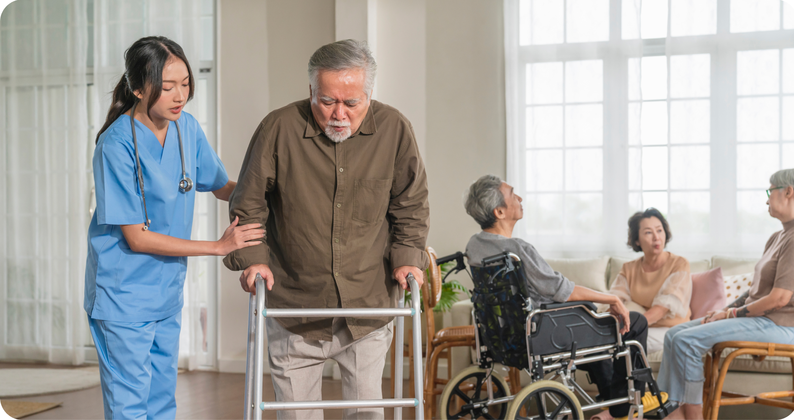 Nurse helping elderly man with walker