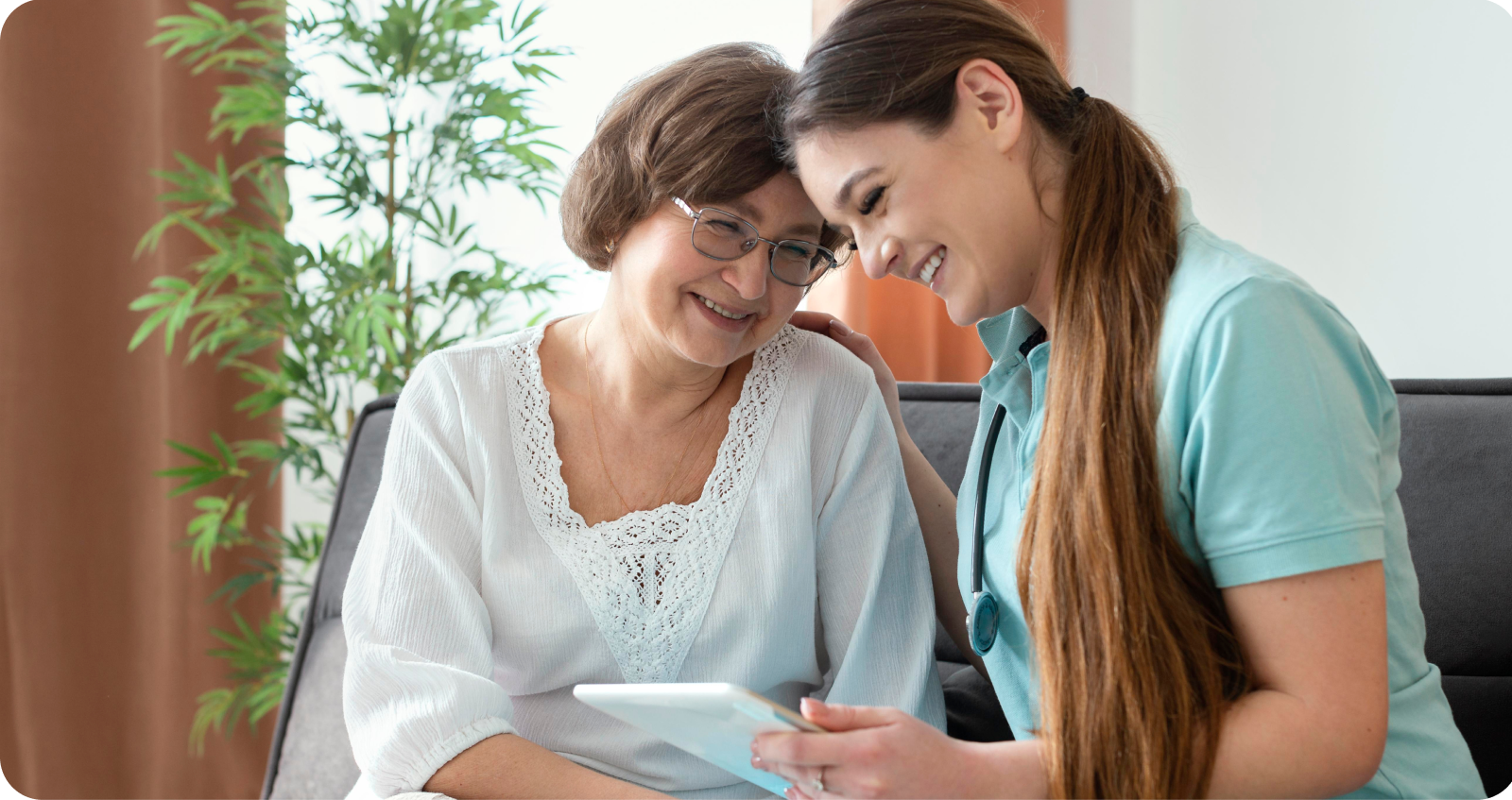 Nurse speaking with elderly woman