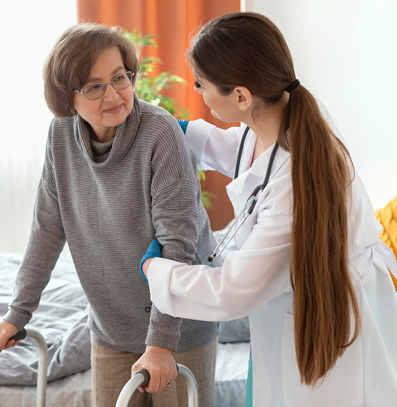 Nurse supporting elderly patient